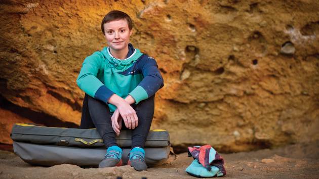 Inventor Jessamy Taylor sits in front of a boulder at Oregon’s Smith Rock State Park 